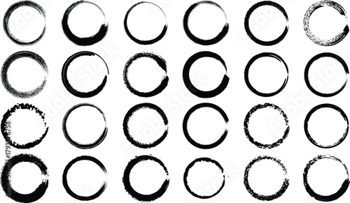 an arrangement of black circular brush strokes forming incomplete rings on a white background