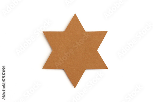 Six-pointed star shape cut from brown cardboard isolated on white background