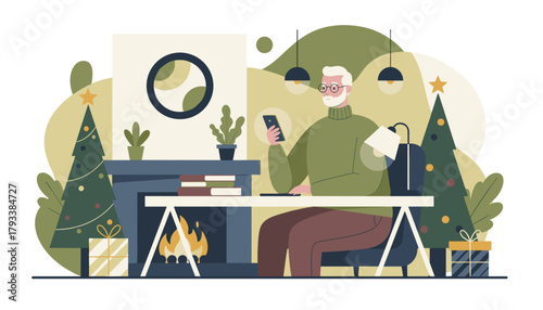 Senior man using a smartphone at his cozy Christmas home office desk with a fireplace and festive decor