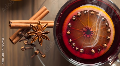 Warm spiced wine with orange and cinnamon sticks