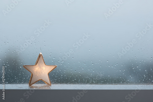 solitary star shines brightly on snowcovered window creating magical atmosphere