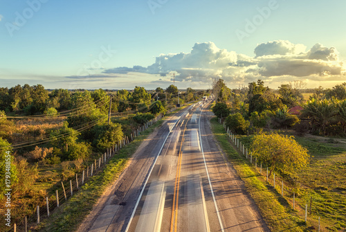 Rural Highway at Sunset with Light Trails