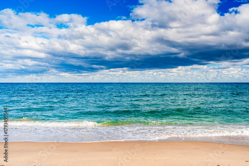 waves gently crashing on sandy beach