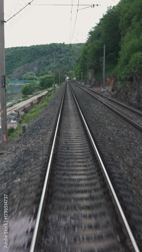 A train tracks with a view of the mountains in the background