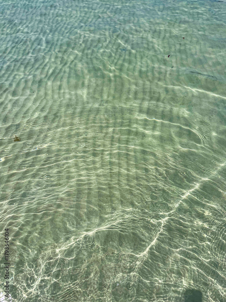 Fototapeta premium Transparent clear water on a white sand beach