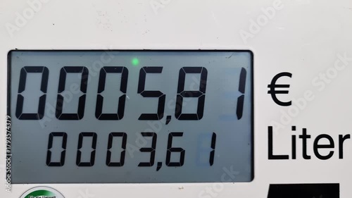 Rising fuel price on a gas station pump display