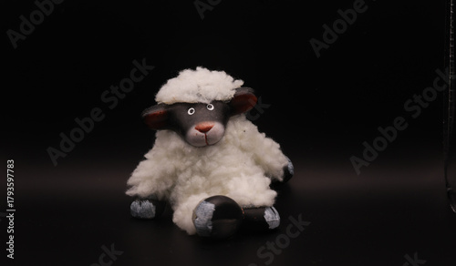 Cute Fluffy White Sheep Toy on Dark Background