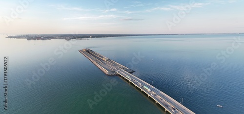 Wallpaper Mural Aerial View Of Long Monitor Merrimac Memorial Bridge Tunnel crossing tranquil blue water of Hampton Roads Channel with a distant harbor and open sky Torontodigital.ca