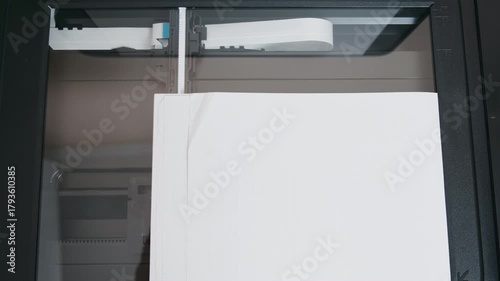 top-down scanner bed scanning blank paper. high-resolution close-up of white sheet on glass, automated carriage and illumination moving across page,