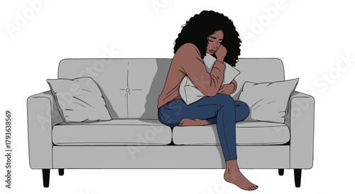 Young black woman sitting alone on sofa hugging a pillow. Woman crying on sofa  
