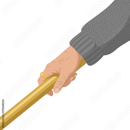 Close-up of a hand gripping a wooden stick with a dark background emphasizing detailed textures