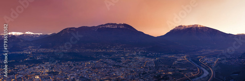 Panorama of the city of Trent and Adige river after dark