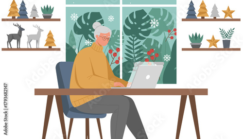 Happy senior woman using a laptop in a cozy home office decorated for winter holidays