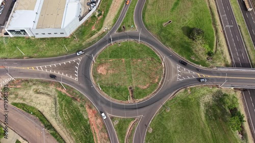 An aerial view captures the intricacies of a roundabout and road
