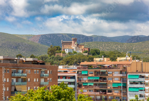Exterior view of Castelldefels Castle, a 10th-century fortress on a sunny summer day