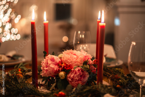 Cozy Holiday Centerpiece with Pink Flowers and Red Candles 
