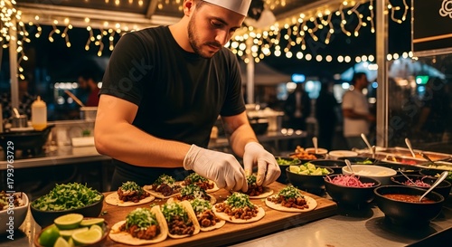 Chef preparing delicious tacos at a vibrant food truck event at night.