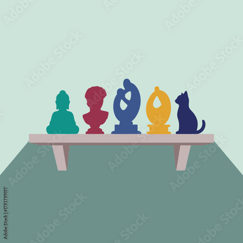 Shelf with colorful statues: Buddha, bust, abstract figures, and a cat.