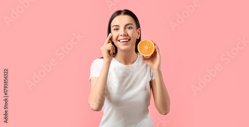 Beautiful woman with orange...