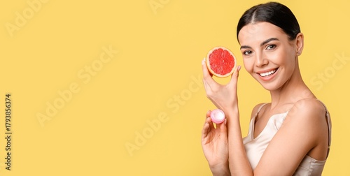 Beautiful woman with grapef...
