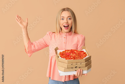 Young happy woman holding c...