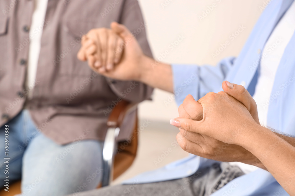 Fototapeta premium People holding hands at group therapy session, closeup