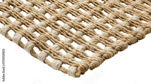 Woven neutral rug corner with textured, knotted pattern on black background