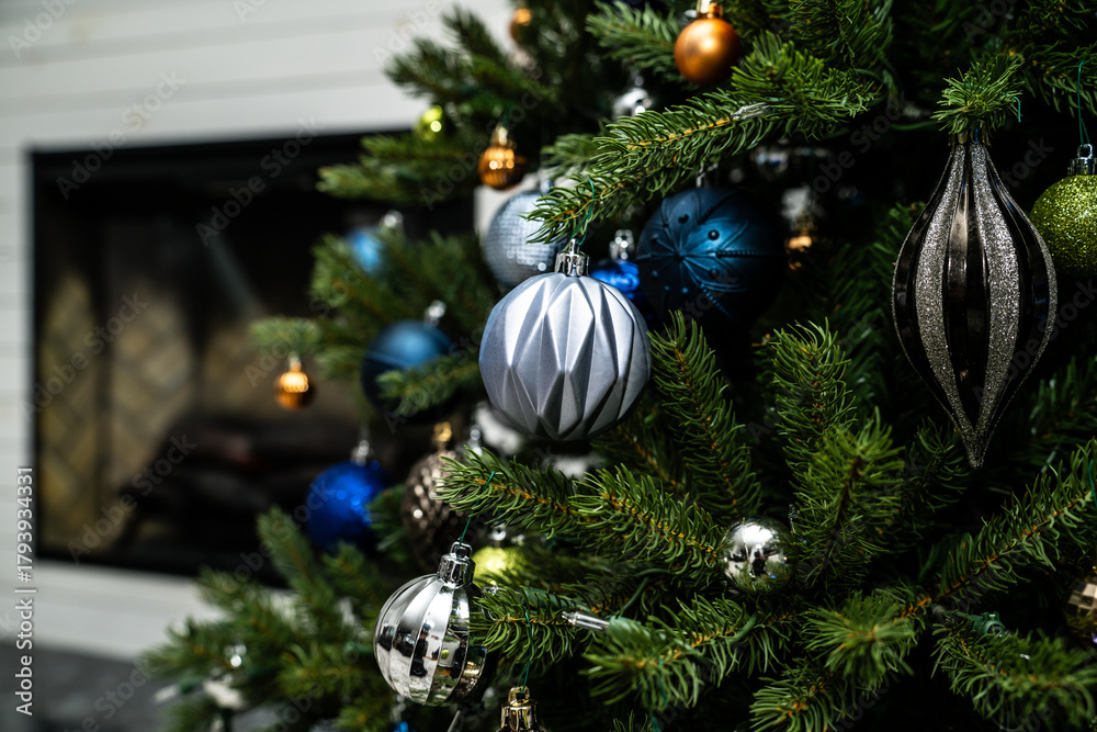 Fototapeta premium Artificial Christmas tree with silver and blue ornaments