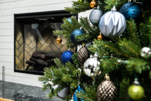 Artificial Christmas tree with silver and blue ornaments