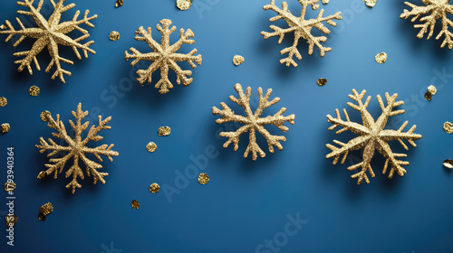 Christmas background image. Gold snowflakes and blue background.