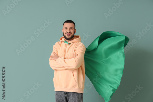 Young man with superhero ca...