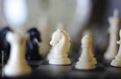 chess pieces on the chess board artistic background game playing competition	
