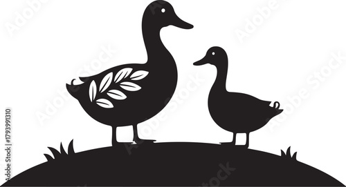 Two black silhouette ducks standing on a grassy mound with a white leaf pattern on one duck