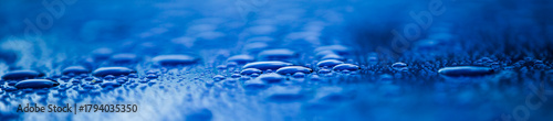 water drops on blue background, panoramic banner with copy space
