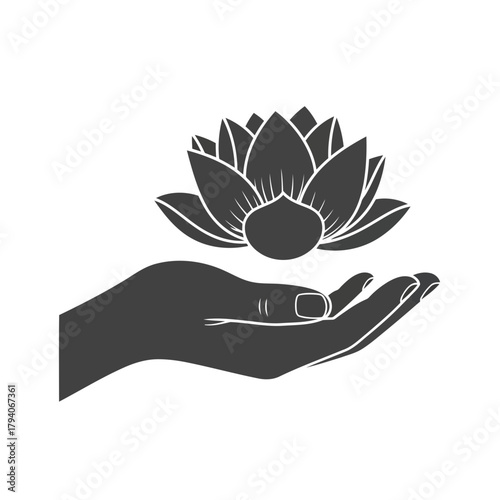 Hand holding a lotus flower