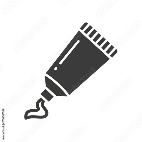 A dark grey icon of a tube of cream with a small amount squeezed out