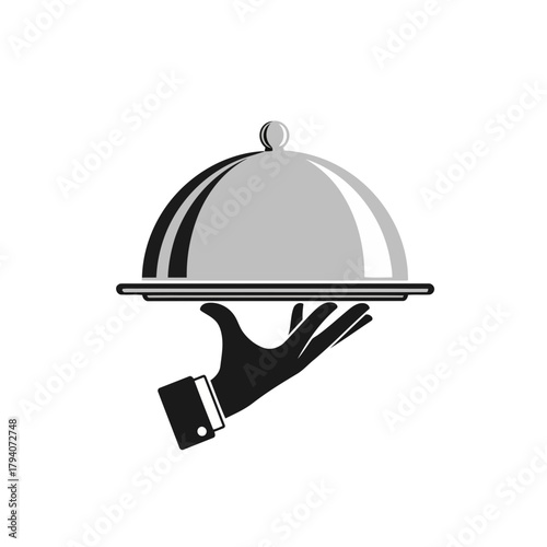A black gloved hand holding a silver serving cloche with a handle