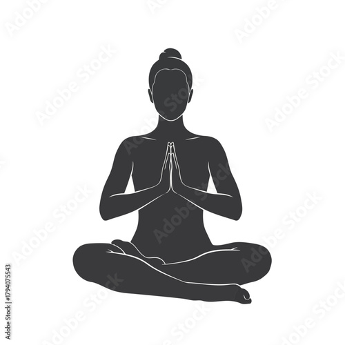 Silhouette of a person meditating in a lotus position