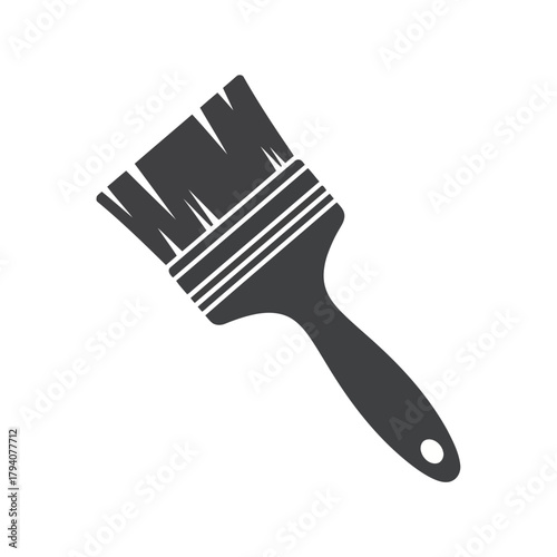 A dark gray silhouette of a paintbrush, isolated on a, symbolizing art and renovation