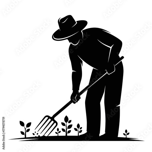 Farmer working in the garden with a pitchfork