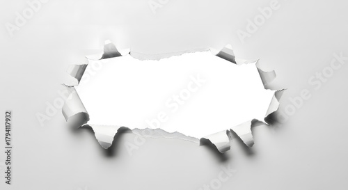 Horizontal tear hole in the center of a clean white sheet of paper