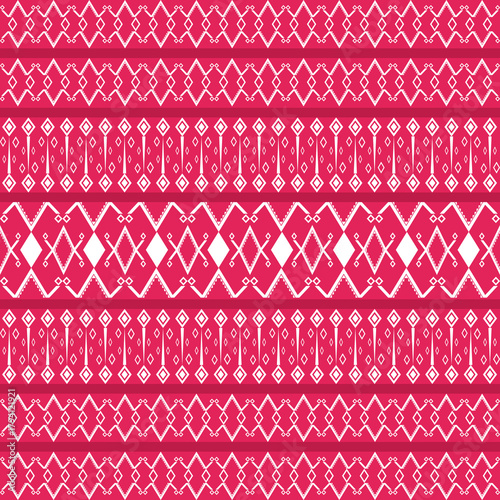 A passionate and bold seamless vector pattern featuring a repetitive layout of traditional tribal motifs, diamonds, and linear borders in a deep red and bright pink color combination.