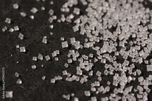 Close-up of the surface of white salt grains, macro salt