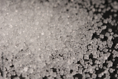 Close-up of the surface of white salt grains, macro salt