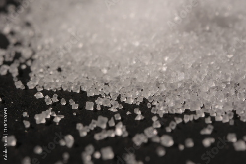 Close-up of the surface of white salt grains, macro salt