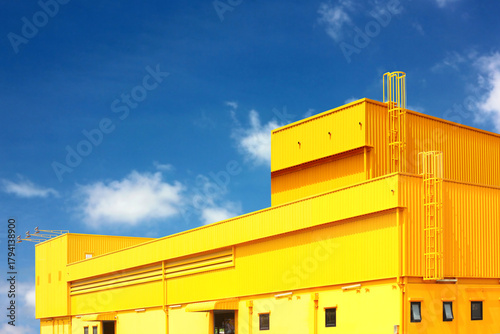 architecture design square shape corrugated wall geometric buiding. The factory warehouse is exterior decorated with corrugated texture to create a point of interest with beautyl