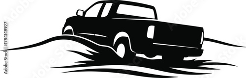 Silhouette of a pickup truck navigating a sandy dune, symbolizing freedom and exploration, a versatile vehicle for work and play