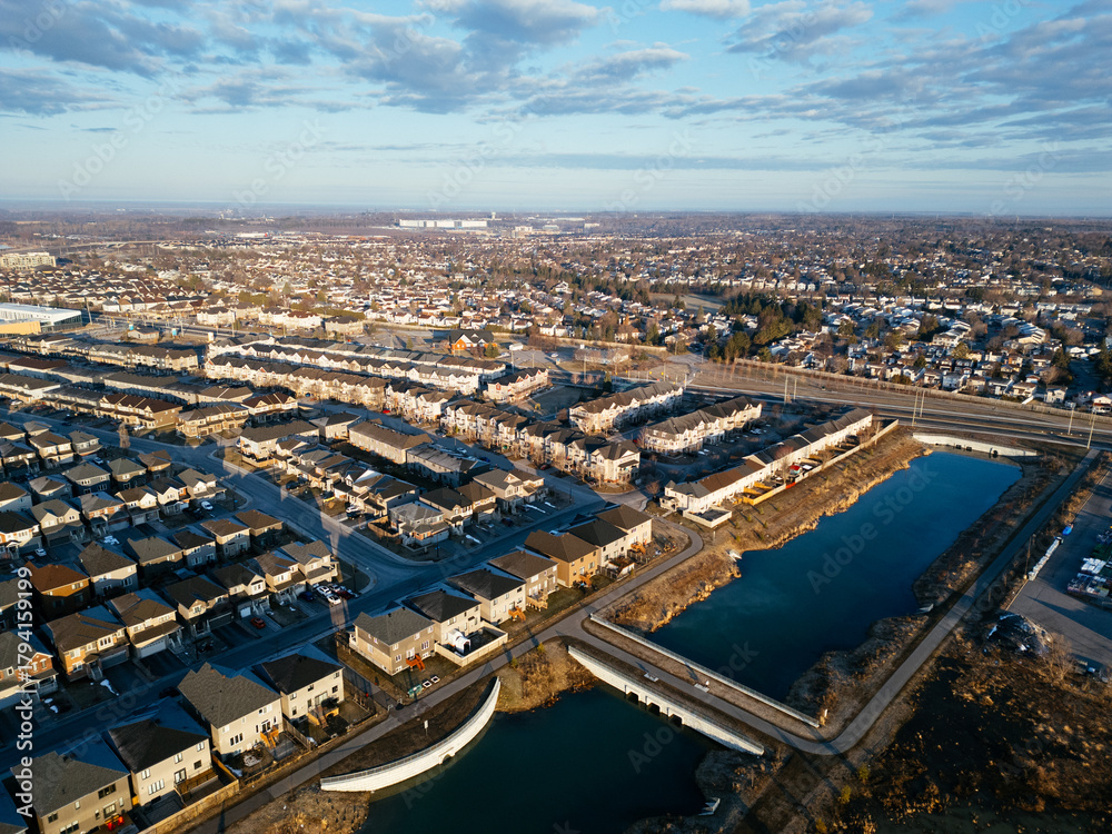 Fototapeta premium Aerial view of Barrhaven suburban housing development in Ottawa during early winter morning light. g.