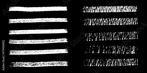 Collection of white chalk brush strokes and textured lines on a black background
