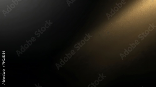 Golden light beam shining from the top right corner on a dark background
